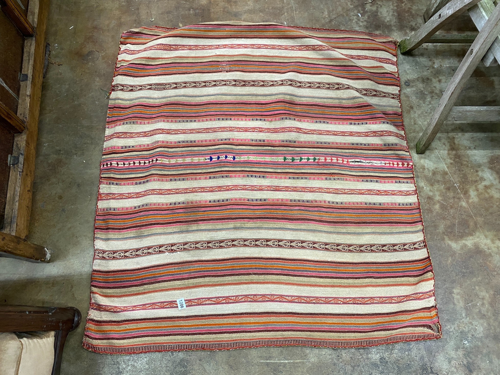 A flatweave Kilim rug, woven with a geometric design 120cm x 106cm